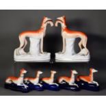 PAIR OF NINETEENTH CENTURY STAFFORDSHIRE FLAT BACK POTTERY MODELS OF GREY HOUNDS, each painted in