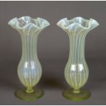 PAIR OF JOHN WALSH WALSH VASELINE GLASS VASES, each of footed tulip form with frilled rim,