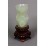 MODERN ORIENTAL GREEN JADE COLOURED CARVED HARDSTONE CUP, of rounded oblong, tapering form, with