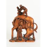 WELL CARVED CHINESE BLONDE WOOD GROUP, modelled as a man driving an oxen with two children