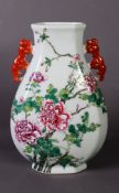 CHINESE FAMILLE ROSE PORCELAIN VASE, tear shaped, with two red kylin handles, the front enamelled