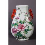 CHINESE FAMILLE ROSE PORCELAIN VASE, tear shaped, with two red kylin handles, the front enamelled