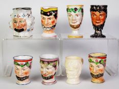 COLLECTION OF EIGHT SATYR MASK MOULDED PORCELAIN CUPS AND JUGS, 5 and 3 respectively, one cup in