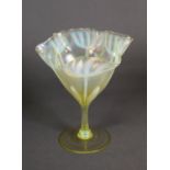 JOHN WALSH WALSH VASELINE GLASS STEMMED DRINKING GLASS, the bowl worked in white with tulips beneath