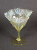 JOHN WALSH WALSH VASELINE GLASS STEMMED DRINKING GLASS, the bowl worked in white with tulips beneath