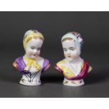 PAIR OF CAPO DIMONTE CHINA BUSTS OF YOUNG WOMEN, each painted in colours and gilt, and raised on a