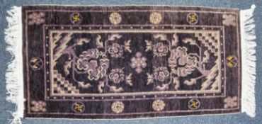 ORIENTAL RUG, mauve and white with double ended tree design, line delineated border with space mon