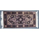 ORIENTAL RUG, mauve and white with double ended tree design, line delineated border with space mon