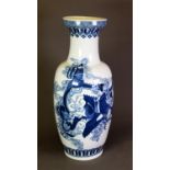 MODERN ORIENTAL BLUE AND WHITE PORCELAIN VASE, of rouleau form, painted with figures riding a dragon