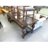 A 1930's JACOBETHAN FOUR PILLAR REFECTORY DINING TABLE, HAVING LARGE BULBOUS SUPPORTS (198cm long