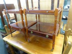A PAIR OF YEW WOOD TWO TIER WHAT-NOTS WITH SLIDES AND BASAL DRAWERS, ON TURNED TAPERING LEGS (2)