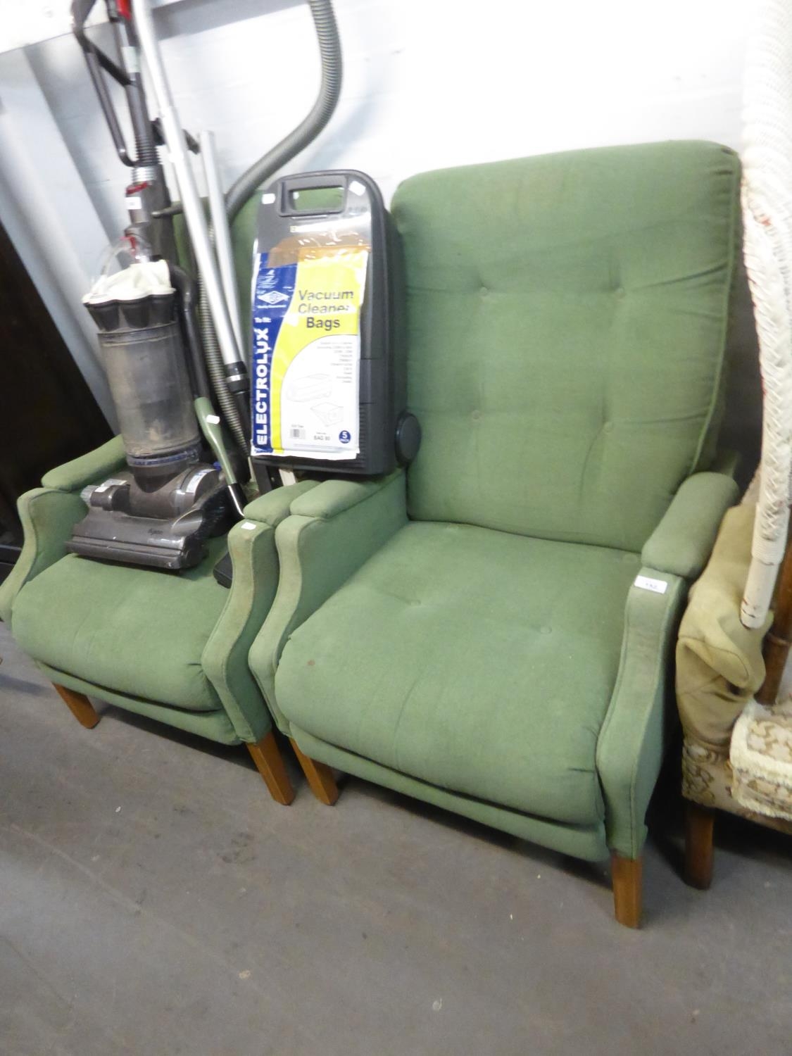 A PAIR OF CINTIQUE ALL-UPHOLSTERED FIRESIDE ARMCHAIRS IN PLAIN GREEN FABRIC, ON MOULDED SQUARE