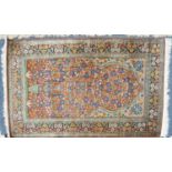 SEMI-ANTIQUE EASTERN PART-SILK PRAYER RUG of vase and flowering shrub design filling the crimson