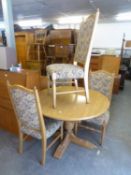 A SET OF FOUR PARKER KNOLL LIGHT OAK DINING CHAIRS, THE HIGH BACKS AND SEATS COVERED IN PATTERNED