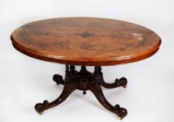 VICTORIAN INLAID AND FIGURED WALNUT LOO TABLE the oval tilt top decorated with foliate scroll inlays