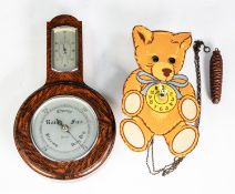 TWENTIETH CENTURY WEST GERMAN TRANSFER PRINTED WOODEN NOVELTY WALL CLOCK, modelled as a teddy bear