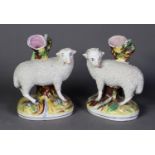 PAIR OF REPRODUCTION STAFFORDSHIRE POTTERY SPILL VASES, each painted in colours and modelled with