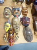 A COLLECTION OF SOUTH EAST ASIAN TRIBAL MASKS (8)