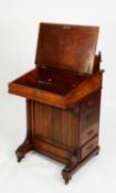 VICTORIAN AESTHETICS MOVEMENT CARVED WALNUT DAVENPORT DESK, the raised stationary compartment with