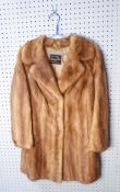 LADY'S LIGHT BROWN 3/4 LENGTH FUR COAT, with revered collar, hook fastening, single breasted front