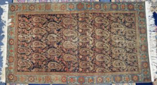 SEMI-ANTIQUE EASTERN KELIM FLAT WEAVE RUG, with all-over boteh design on a black field, pale blue