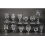 PAIR OF EARLY TWENTIETH CENTURY CUT GLASS WINE GOBLETS, the bowls with stud cut band and TEN OTHER