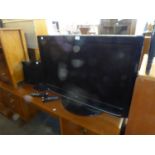 LG 37" TELEVISION IN BLACK CASE AND A SAMSUNG 18" TELEVISION, BOTH WITH REMOTE CONTROLS (2)