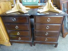 A PAIR OF SMALL DARK MAHOGANY ‘STAG’ FOUR DRAWER CHESTS
