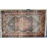 SEMI-ANTIQUE PERSIAN FINELY KNOTTED PART-SILK RUG with circular scolloped edge, red centre medallion