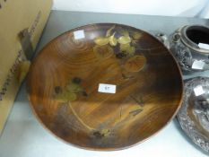 EARLY TWENTIETH CENTURY JAPANESE TURNED HARDWOOD FOOTED BOWL, heavily grained and applied in