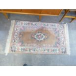 A WASHED CHINESE RUG, PINK AND FLORAL (170cm x 91cm)