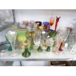 GOOD SELECTION OF COLOURED GLASS STEM WINES VASES, ETC MAINLY WITH GILT AND OTHER DECORATION