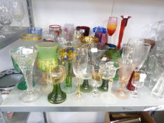 GOOD SELECTION OF COLOURED GLASS STEM WINES VASES, ETC MAINLY WITH GILT AND OTHER DECORATION