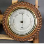 OAK FRAMED COMBINATION ANEROID BAROMETER AND THERMOMETER, the silvered dial reading from 28-31,