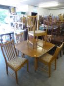 ERCOL BLOND WOOD DINING ROOM SUITE OF SEVEN PIECES, VIZ 6 RAIL BACK DINING CHAIRS (4 + 2) AND A