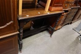 A LATE VICTORIAN MAHOGANY SMALL OBLONG SIDE TABLE, ON FOUR TURNED LEGS, JOINED BY ORNATELY PIERCED H