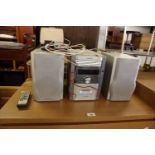 SHARP XL-HP605 STEREO WITH SPEAKERS AND REMOTE CONTROL, TAPE, RADIO AND 5 CD MULTI CHANGER
