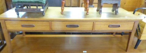 A LOW THREE DRAWER, DOUBLE SIDED TEAK COFFEE TABLE, 4'6" long x 1'6" deep x 1'4" high