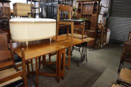 A DROP-LEAF DINING TABLE WITH 'X' SUPPORTS AND A SET OF FIVE TEAK DINING CHAIRS (A.F.) (6)