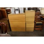 A MODERN BEECH EFFECT CHEST OF FOUR DEEP DRAWERS AND A PAIR OF SIMILAR TWO DRAWER BEDSIDE CHESTS (3)