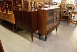 A LATE 1950's/60's SIDE CABINET, WITH SLIDING GLASS FRONTED SHELVES, ALSO A TWO DOOR TV. CABINET (2)