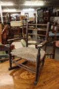 A CHILD'S RUSH SEATED ROCKING CHAIR
