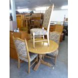 A SET OF FOUR PARKER KNOLL LIGHT OAK DINING CHAIRS, THE HIGH BACKS AND SEATS COVERED IN PATTERNED