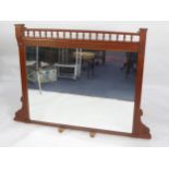 LATE VICTORIAN/ EDWARDIAN CARVED WALNUT FRAMED OVERMANTLE MIRROR, the oblong plate within a