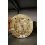 SMITHS ART DECO MANTEL CLOCK WITH CIRCULAR ONYX PANEL OVERLAID WITH A GILT METAL ARABIC CHAPTER