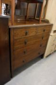 1930’S OAK BEDROOM CHEST OF TWO SHORT AND THREE GRADUATED LONG DRAWERS, WITH PIERCED BRASS DROP