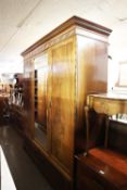 A MAHOGANY CHIPPENDALE REVIVAL LARGE WARDROBE, THE LOOSE CORNICE HAVING BLIND FRET CARVED FRIEZE,