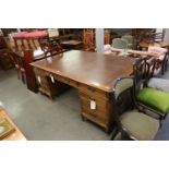 A LARGE TWIN PEDESTAL PARTNERS DESK, EACH PEDESTAL HAVING THREE DRAWERS AND CUPBOARDS TO THE