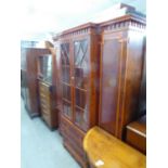 YEW WOOD BREAKFRONT LIBRARY BOOKCASE, THE CENTRE SECTION WITH TWO ASTRAGAL GLAZED DOORS OVER THREE