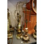 FOUR ONYX AND BRASS TABLE LAMPS AND TWO SILK SHADES